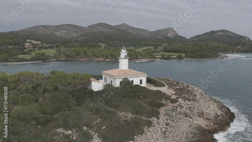 faro playa Alcanada Alcudia olas playa isla