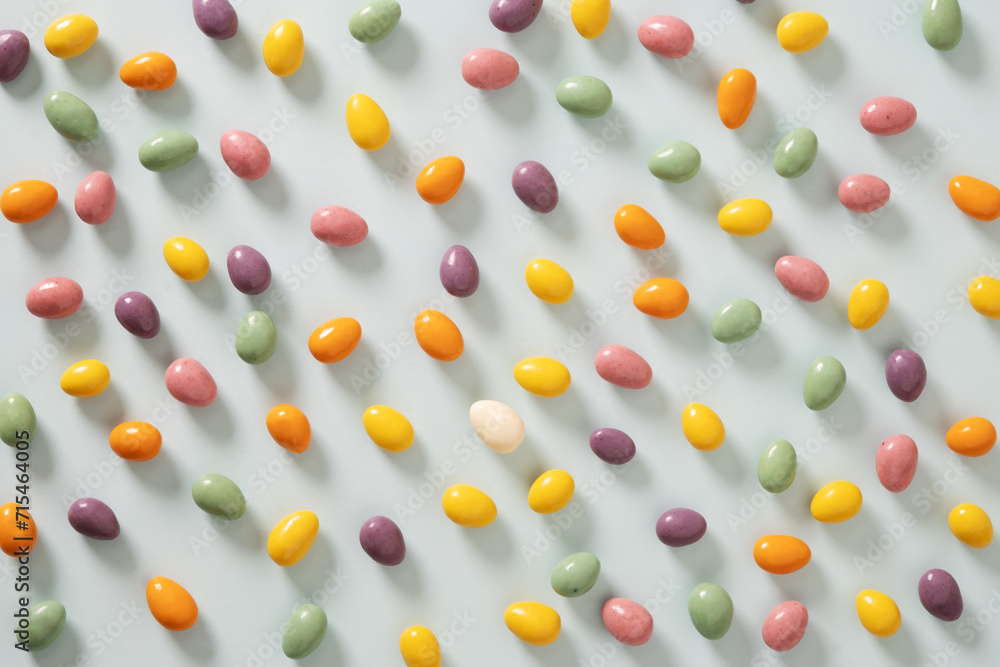 Easter pattern with pastel chocolate eggs on blue background. Religion tradition. Flat lay style. View from above. Easter pattern with pastel chocolate eggs on blue background. Religion tradition. Flat lay style. View from above.