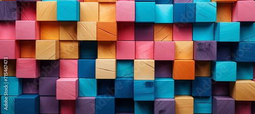 Vibrant assortment of colorful wooden blocks perfectly arranged on wide format background