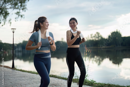 female friend go to exercise together at village park in evening, working out for health