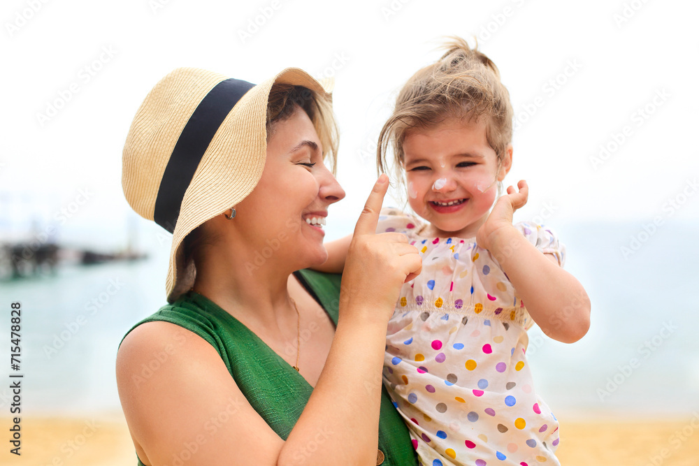 Mother and baby daughter at the beach Mother and baby daughter at the beach