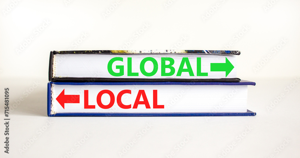 Global or local symbol. Concept word Global or Local on beautiful books. Beautiful white table white background. Business and global or local concept. Copy space.