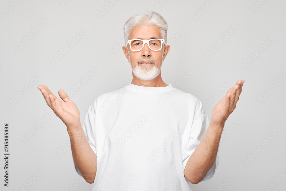 Portrait gray-haired man happy face smiling joyfully with raised palms and shocked open mouth isolated on white studio background. Portrait gray-haired man happy face smiling joyfully with raised palms and shocked open mouth isolated on white studio background.
