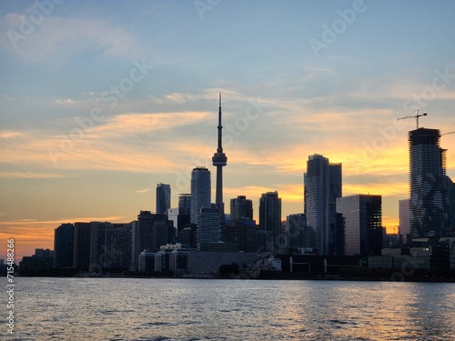 Stunning sunset view of the Toronto skyline across the tranquil lake