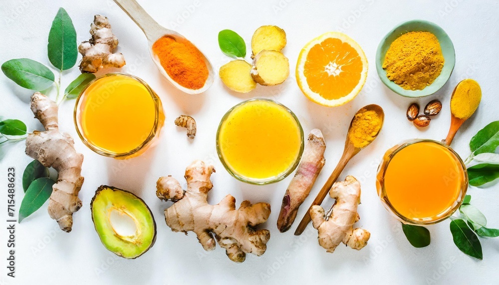 immune boosting natural vitamin health defending drink flat lay of fresh turmeric ginger and citrus juice shots over white background top view wide composition vegan immunity system booster - obrazy, fototapety, plakaty 