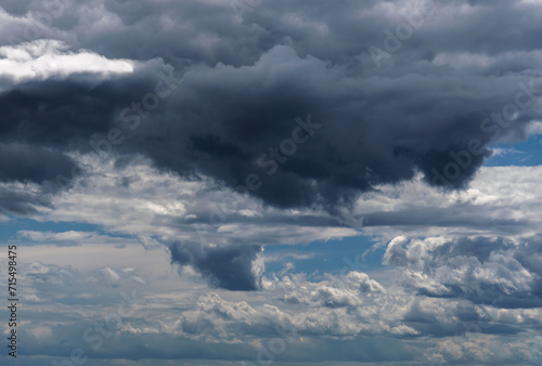 Dramatic sky with white clouds.