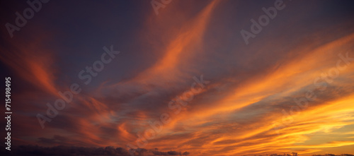 Sunset sky with orange clouds. Nature background. photo