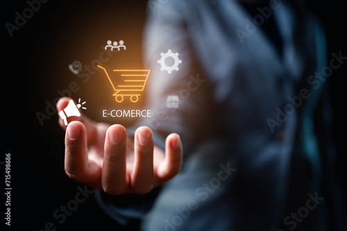 Businessman's Hand with Shopping Cart Icons E-commerce and Product Advertising Connection