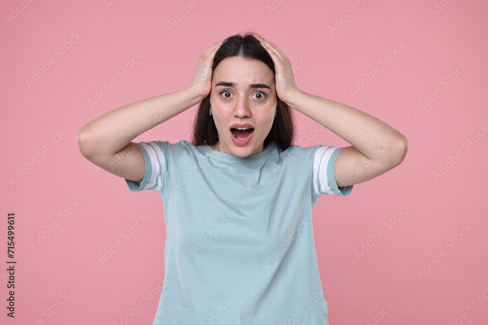 Portrait of surprised woman on pink background Portrait of surprised woman on pink background