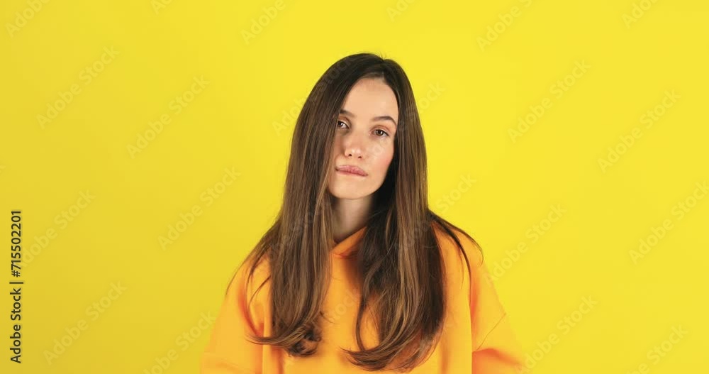 Fake, crying woman face in studio with hands gesture for sad, bullying or gesture on yellow background. Tears, face and female joke, cry and sign on mockup with unhappy boo emoji or fist of loser. Fake, crying woman face in studio with hands gesture for sad, bullying or gesture on yellow background. Tears, face and female joke, cry and sign on mockup with unhappy boo emoji or fist of loser.