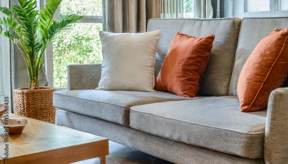 close up of fabric sofa with white and terra cotta pillows french country home interior design of modern living room - obrazy, fototapety, plakaty 