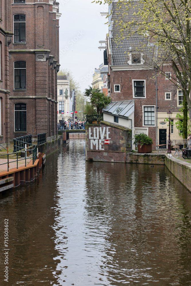 De Wallen - called the red light district. It is famous for its entertainment character: brothels, coffee shops, pubs and restaurants located along the canals