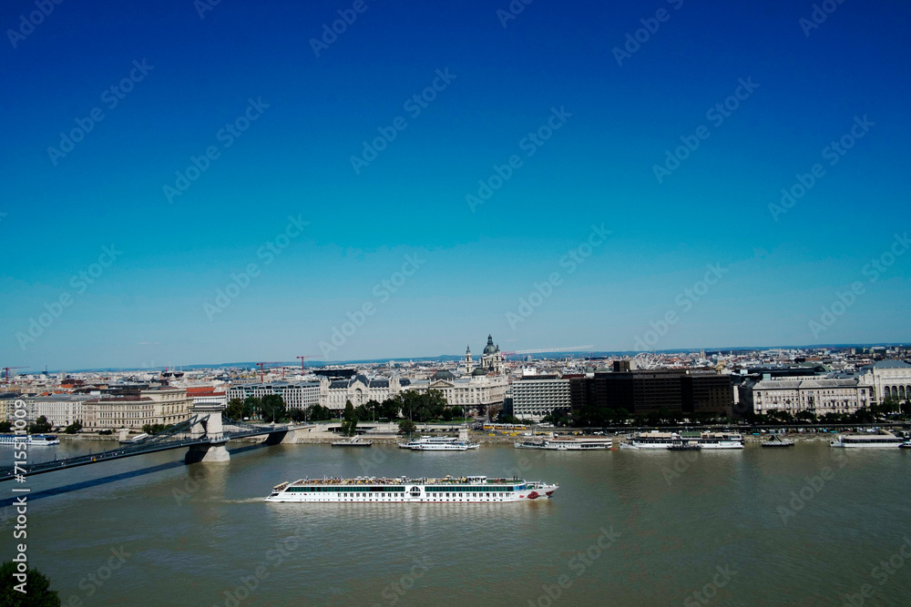 View of sightseeing boat on the River Danube and Budapest, Hungary View of sightseeing boat on the River Danube and Budapest, Hungary