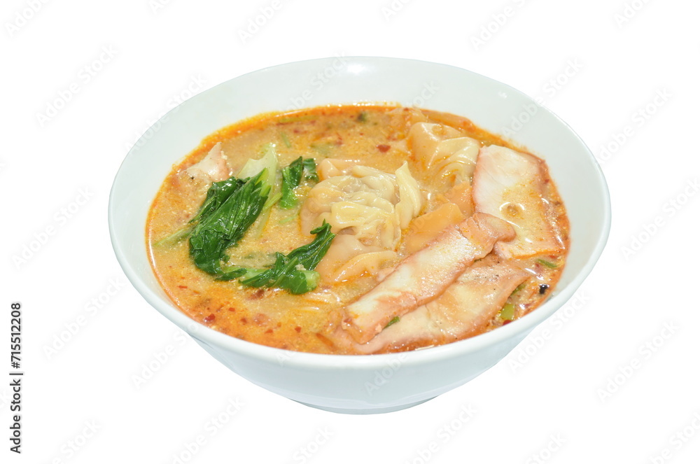 Chinese dumpling topping boiled red barbecue pork with cabbage in tom yum soup on bowl