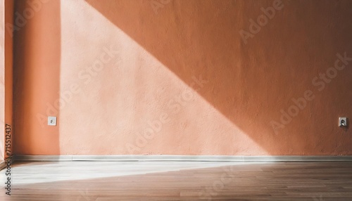 an empty wall in peach fuzz shades and a light floor parquet mockup the creator of the scene the color of 2024