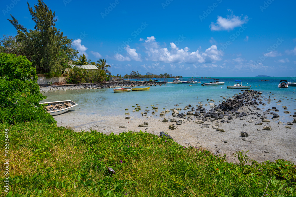 View of beach and turquoise Indian Ocean on sunny day near Poste Lafayette, Mauritius View of beach and turquoise Indian Ocean on sunny day near Poste Lafayette, Mauritius