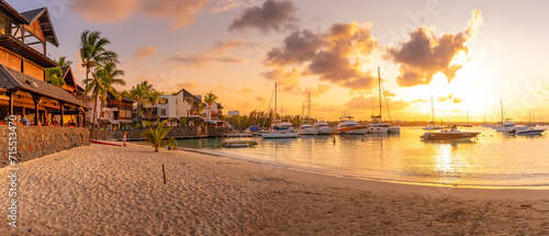 View of beach and boats in Grand Bay at golden hour, Mauritius