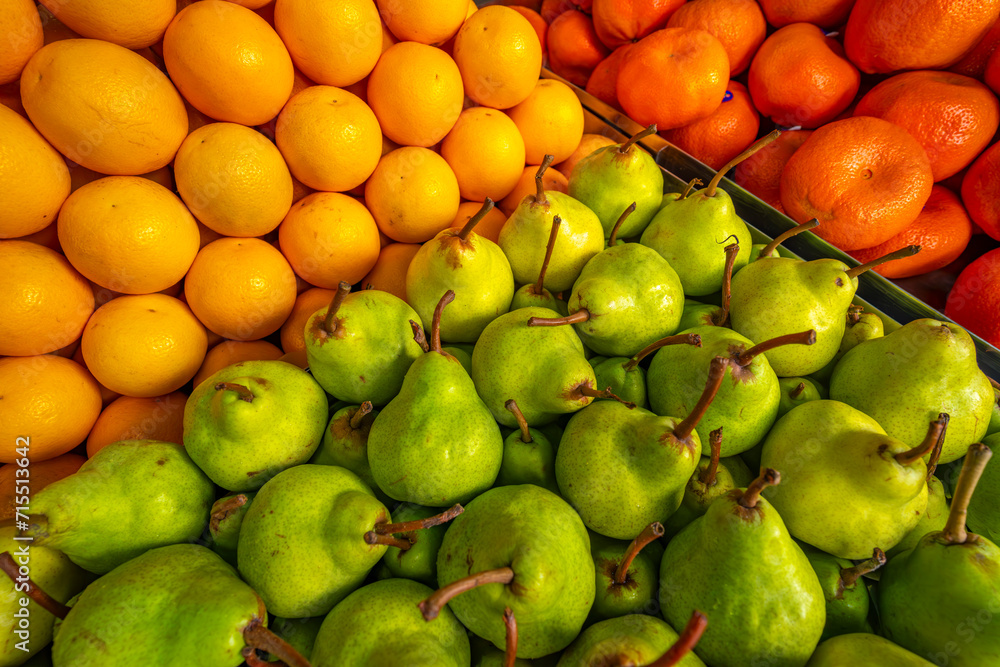 View of produce including pears and oranges on market stall in Central Market in Port Louis, Port Louis, Mauritius View of produce including pears and oranges on market stall in Central Market in Port Louis, Port Louis, Mauritius