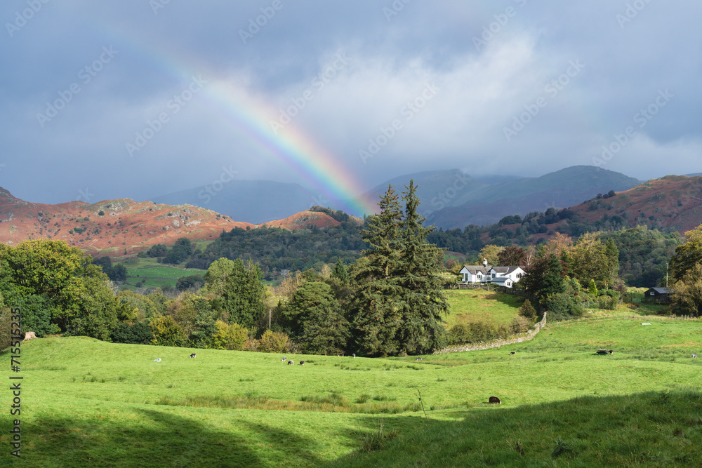 Rainbow and showers over the Cumbrian Fells around Elter Water (Elterwater) in the south east Lake District, Lake District National Park, UNESCO World Heritage Site, Cumbria, England Rainbow and showers over the Cumbrian Fells around Elter Water (Elterwater) in the south east Lake District, Lake District National Park, UNESCO World Heritage Site, Cumbria, England