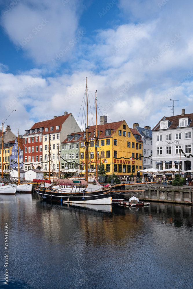 Colourful buildings and tall masted boats on the waterfront at Nyhavn, Nyhavn Canal, Nyhavn, Copenhagen, Denmark Colourful buildings and tall masted boats on the waterfront at Nyhavn, Nyhavn Canal, Nyhavn, Copenhagen, Denmark