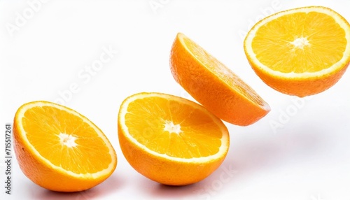 falling fresh orange fruit slices isolated on white background closeup flying food concept top view flat lay orange slice inr without shadow