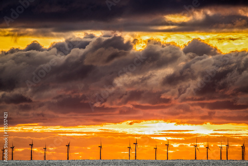 Sunset view from Walney Island across the Irish Dea towards the distant Walney Offshore Wind Farm, Cumbrian Coast, Cumbria, England photo