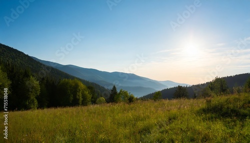 beautiful summer landscape in the mountains with the sun at dawn