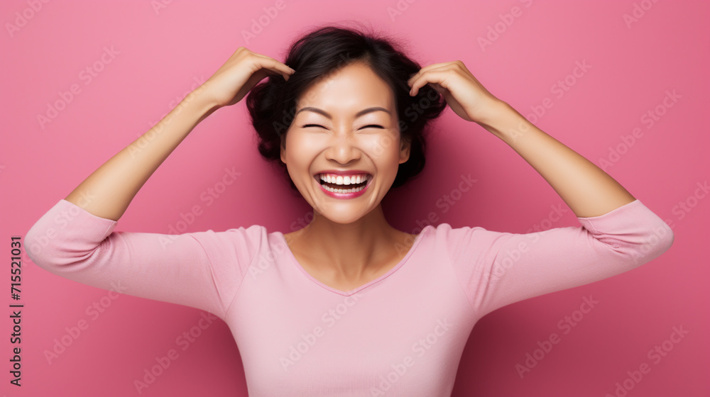 Attractive brunette young Asian woman feels happy and romantic shapes heart gesture expresses tender feelings Attractive brunette young Asian woman feels happy and romantic shapes heart gesture expresses tender feelings