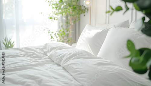 Close up of bed with white bedding, pillow and duvet against home greenery. Scandinavian interior design of modern bedroom © Oleksiy