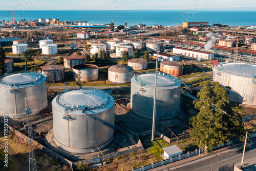 Aerial view of oil tanks at oil refinery. Gas and oil steel storage tanks. Petrol industrial plant