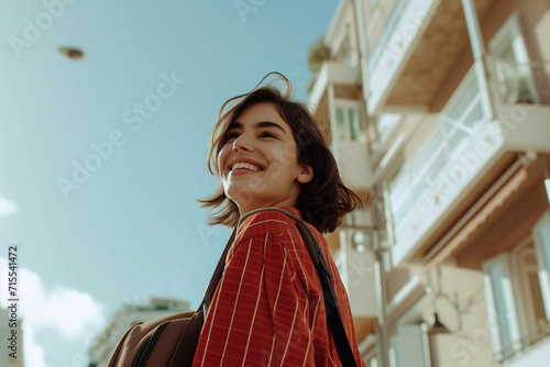 Cheerful Young Woman Walking in Urban Setting