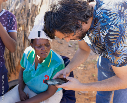 africa, ngo charity volunteer, humanitarian aid ,educating the village people in new developments and technologies, village in Botswana photo