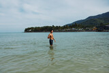 Swim Man in Tropical Waters: A Blissful Vacation Experience Surrounded by the Serene Beauty of the Azure Ocean