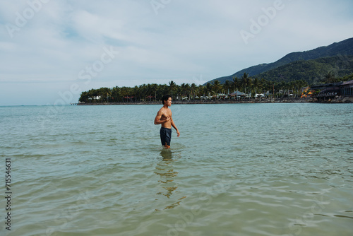 Swim Man in Tropical Waters: A Blissful Vacation Experience Surrounded by the Serene Beauty of the Azure Ocean