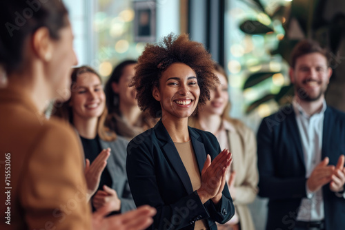 Smiling African American Woman Applauded by Colleagues