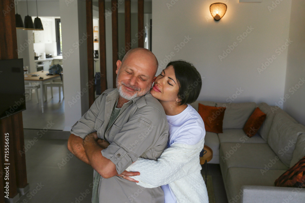 Portrait of affectionate adult couple hugging at home, expressing the love to each other. Close up, copy space, background. Portrait of affectionate adult couple hugging at home, expressing the love to each other. Close up, copy space, background.