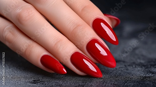 Woman hand with red shades nail polish on her fingernails