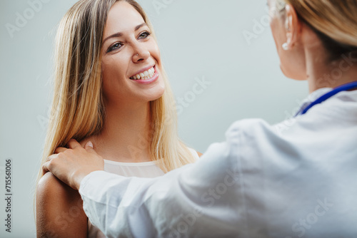 Optimistic patient reassured by doctor's gentle examination