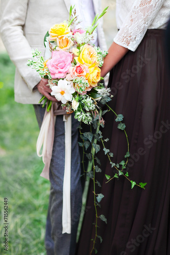 Wedding ceremony. Groom and bride with bouquet