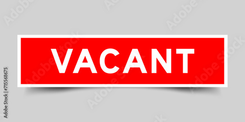 Square sticker label with word vacant in red color on gray background