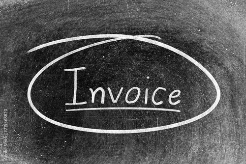 White chalk hand writing in word invoice and circle shape on blackboard background