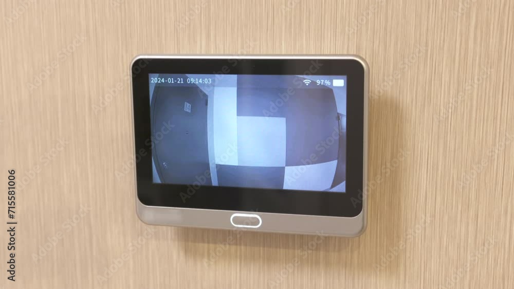 intercom screen of door peephole surveillance camera on entrance door of apartment. Home security and video surveillance. Device to see the person behind the door. intercom screen of door peephole surveillance camera on entrance door of apartment. Home security and video surveillance. Device to see the person behind the door.