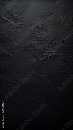 Black rock texture background. Dark black rock texture wallpaper with light reflection background.