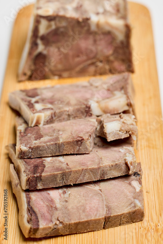 (Toba), traditional Romanian food product on a wooden chopper made with pork. photo