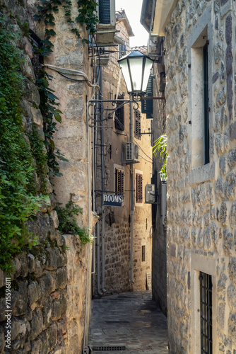 Morning walk along winding narrow streets with ancient stone buildings in the old town of Kotor  Montenegro