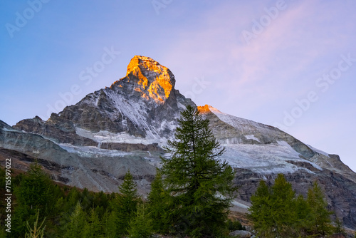 Sunrise on Matternhorn summit. Most famous and highest mountain in Swiss Alps. Mountain top photo