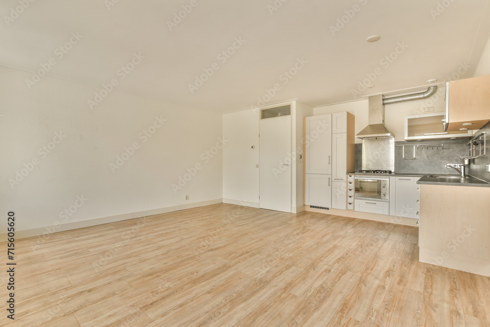 Modern empty kitchen and living area in new apartment Modern empty kitchen and living area in new apartment