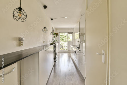 Modern kitchen interior with sleek design and natural light photo