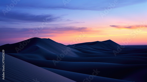 The majestic form of desert dunes against the twilight sky