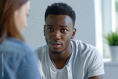 An African American Man Receives Support From A Counselor, Highlighting Social Issues Standard. Сoncept Racial Injustice, Mental Health Support, Social Activism, Counseling, Empowerment